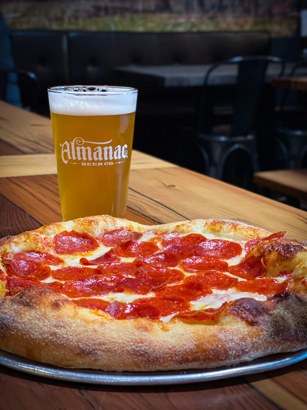 Manic Mondays 12 inch one topping pizza $14.99 $5 select drafts