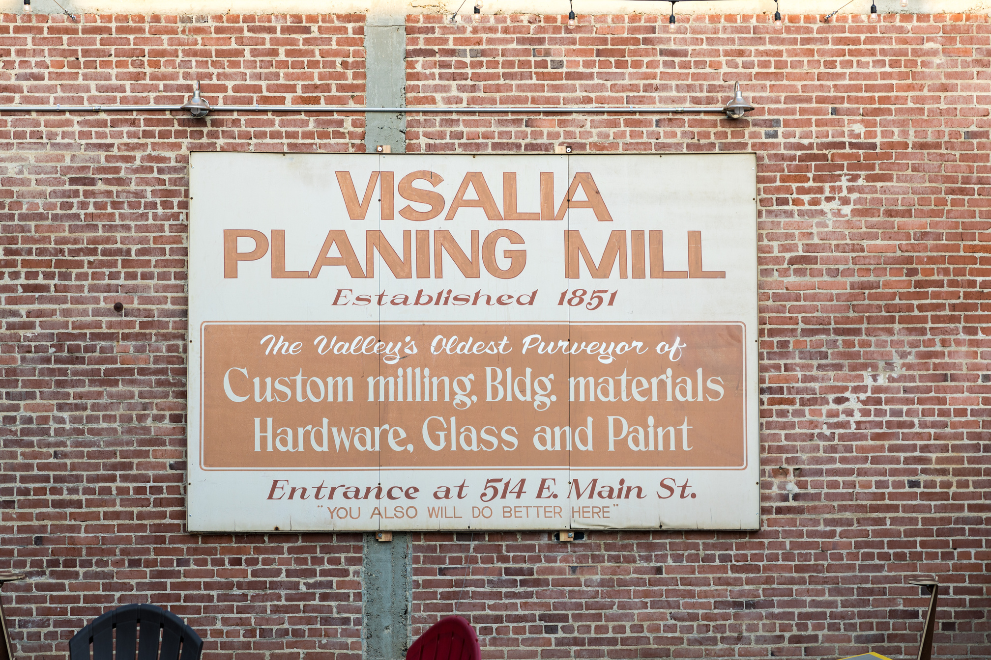 a sign on the side of a building that says visala planning mill