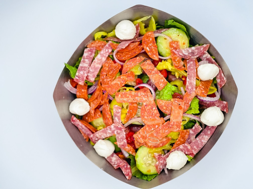 salad with meat and vegetables in a bowl